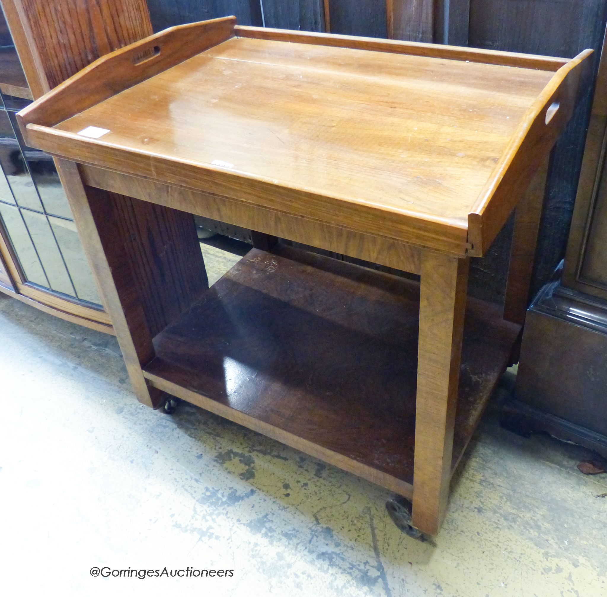 A walnut tray top tea trolley, W-70,D-54, H-74.